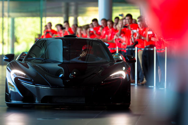 McLaren P1 hypercar at the McLaren Technology Centre in Woking to celebrate the team's first 50 years in operation.